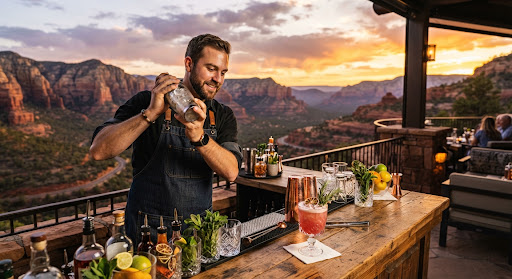 Bartender crafting fresh desert cocktails overlooking sunset canyon